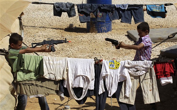 syria refugess in jordan toy guns